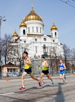 Russian Road Race Championships 2013. The first turn at the Cathedral of Christ the Saviour. Fyedor Shutov (N 20), Dmitriy Shilkin (N 17), Artyem Alekseyev (N 1)